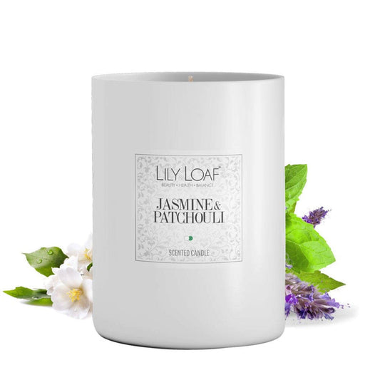 Lily & Loaf Jasmine & Patchouli Soy Wax Candle with jasmine and patchouli flowers at the base.