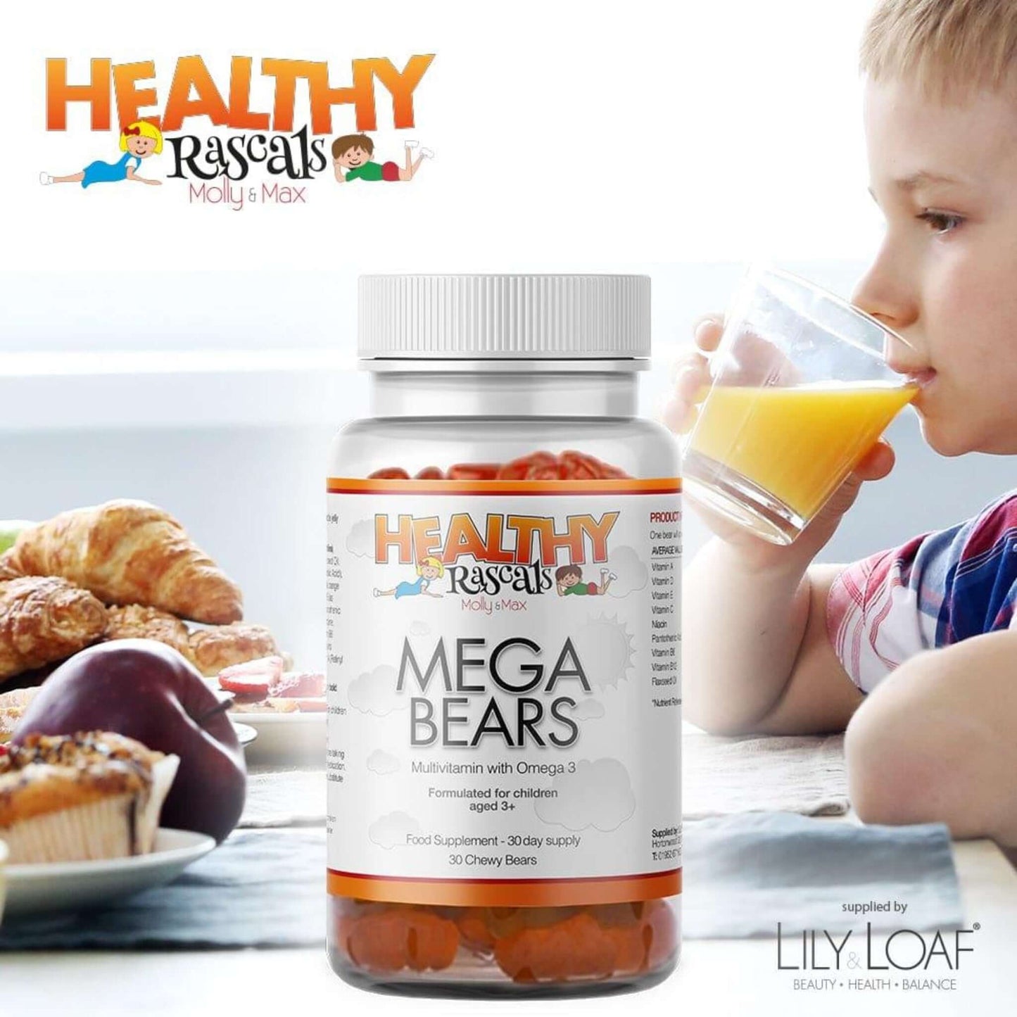 A young boy drinking orange juice at a breakfast table with a bottle of Healthy Rascals Mega Bears Gummy in the foreground