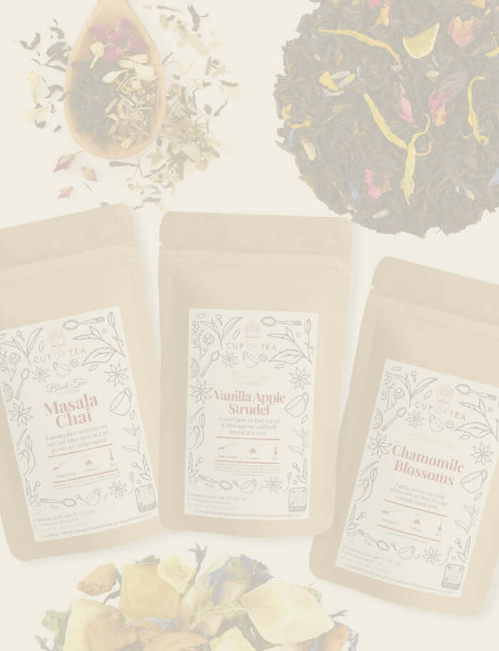 Cup of Tea Loose leaf tea blends with dried fruits and herbs alongside packaged tea pouches on a light background