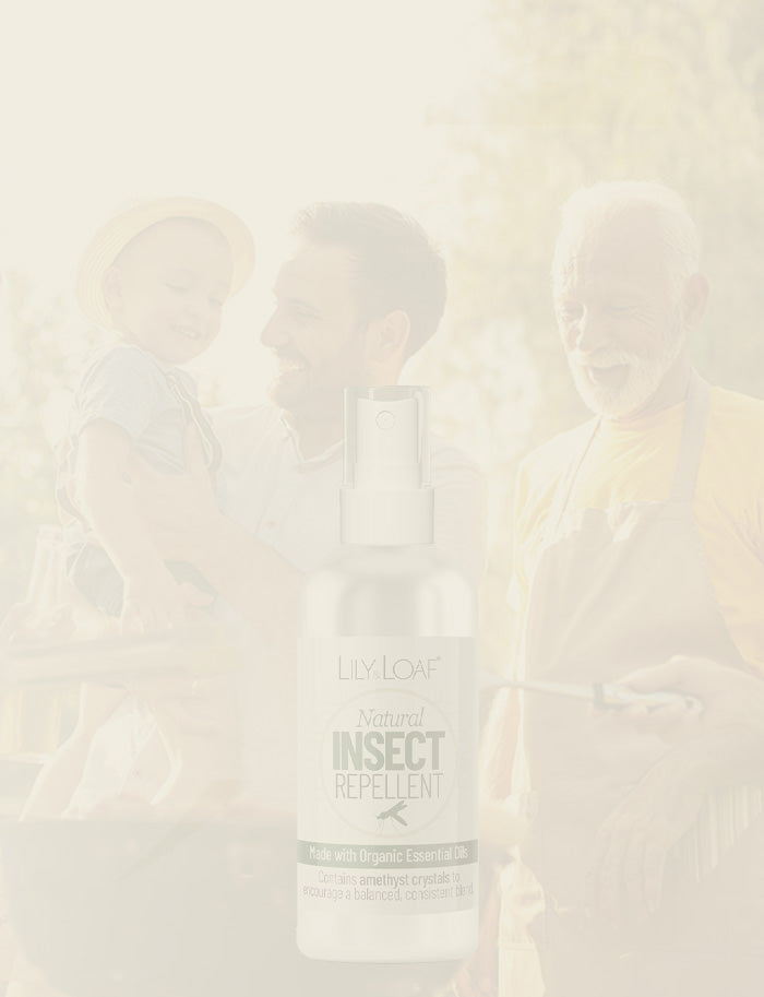 Lily & Loaf Natural Insect Repellent spray bottle with family outdoor background on a light beige overlay