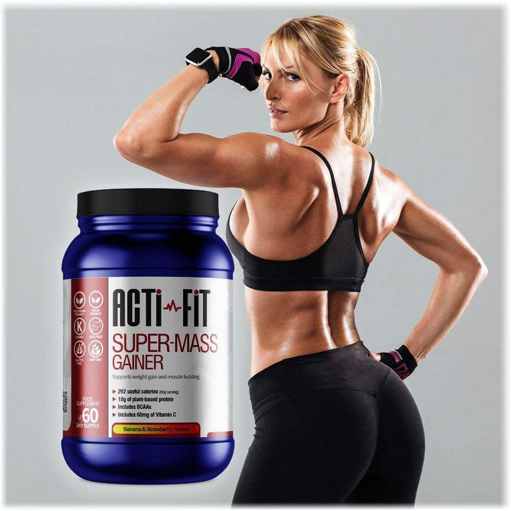 Athletic woman flexing her arm and back beside Acti-Fit Super-Mass Gainer tub, highlighting a high-calorie protein supplement for muscle gain.