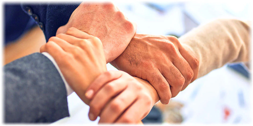 Handshake symbolizing the trust and reliability of the Lily & Loaf brand.