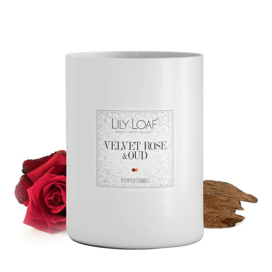 Lily & Loaf Velvet Rose & Oud Soy Wax Candle with rose flower and oud bark at the base