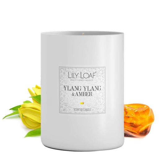 Lily & Loaf Ylang Ylang & Amber Soy Wax Candle with amber resin and ylang ylang flowers at the base