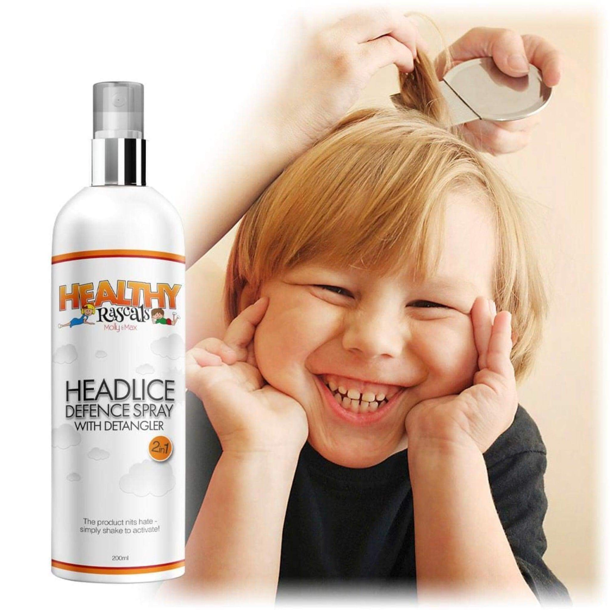 A cheeky young boy smiling whilst his mum inspects his blonde hair for nits with a bottle of Healthy Rascals Headlice Defence Spray & Detangler in the foreground