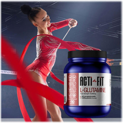 A gymnast dressed in red performing a ribbon routine with a tub of Acti-Fit L-Glutamine 10,000mg in the foreground
