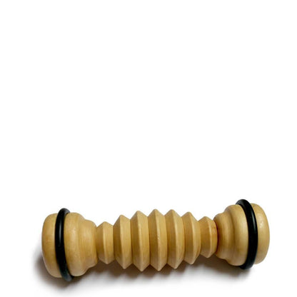 A wooden ribbed foot massager with black accents on the ends.